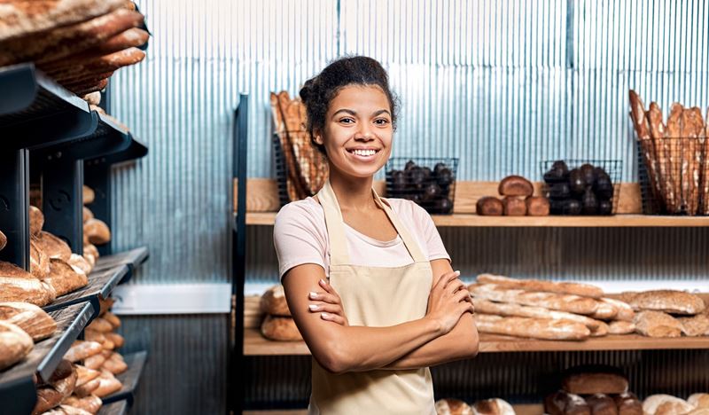 business woman standing in a bakery