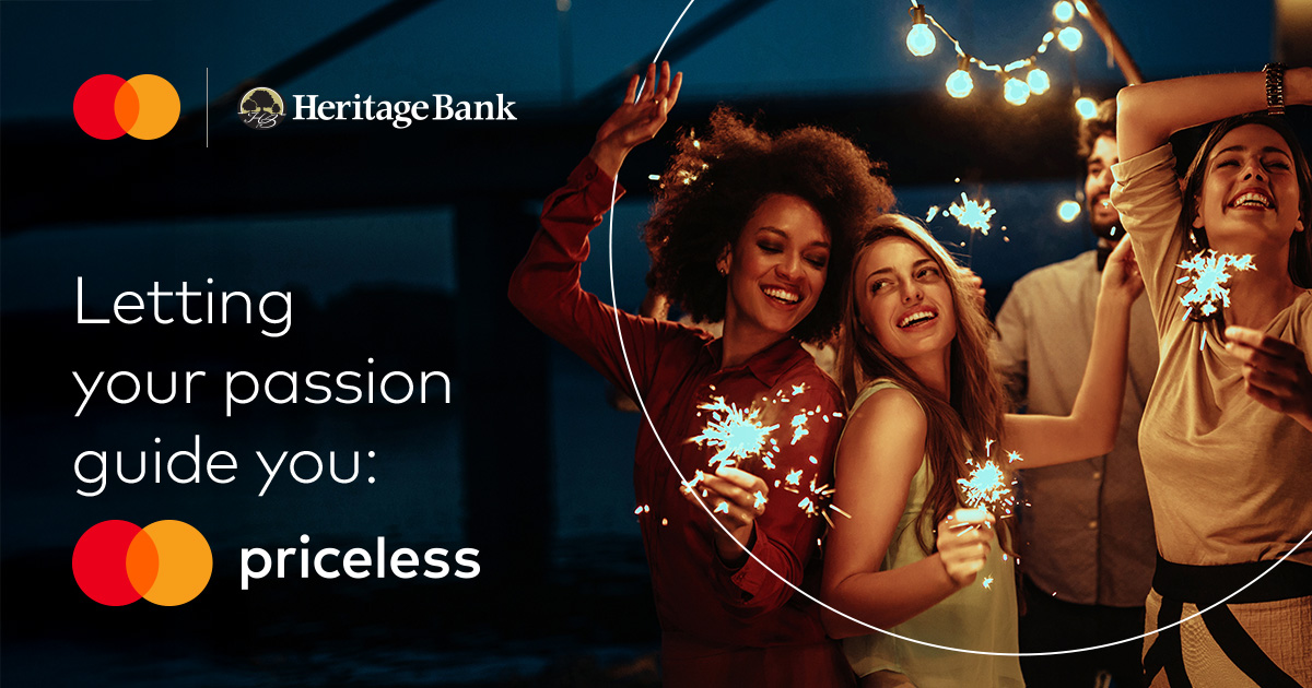 Heritage Mastercard usage promotion image of people celebrating with sparklers against a dark background